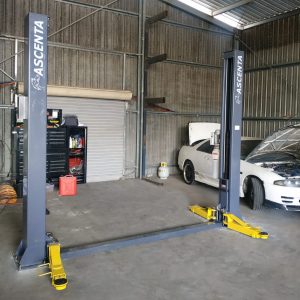 Workshop using 2 post hoist by Garage Equipment